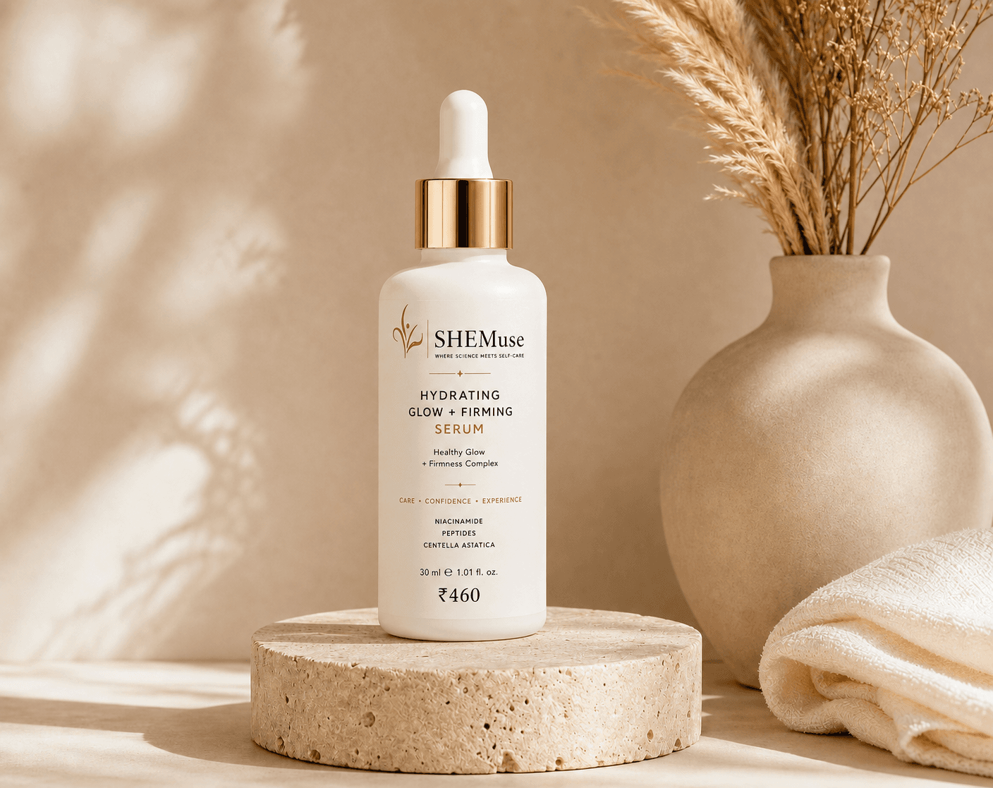 SHEMuse Hydrating Glow & Firming Serum on stone pedestal with natural vase backdrop